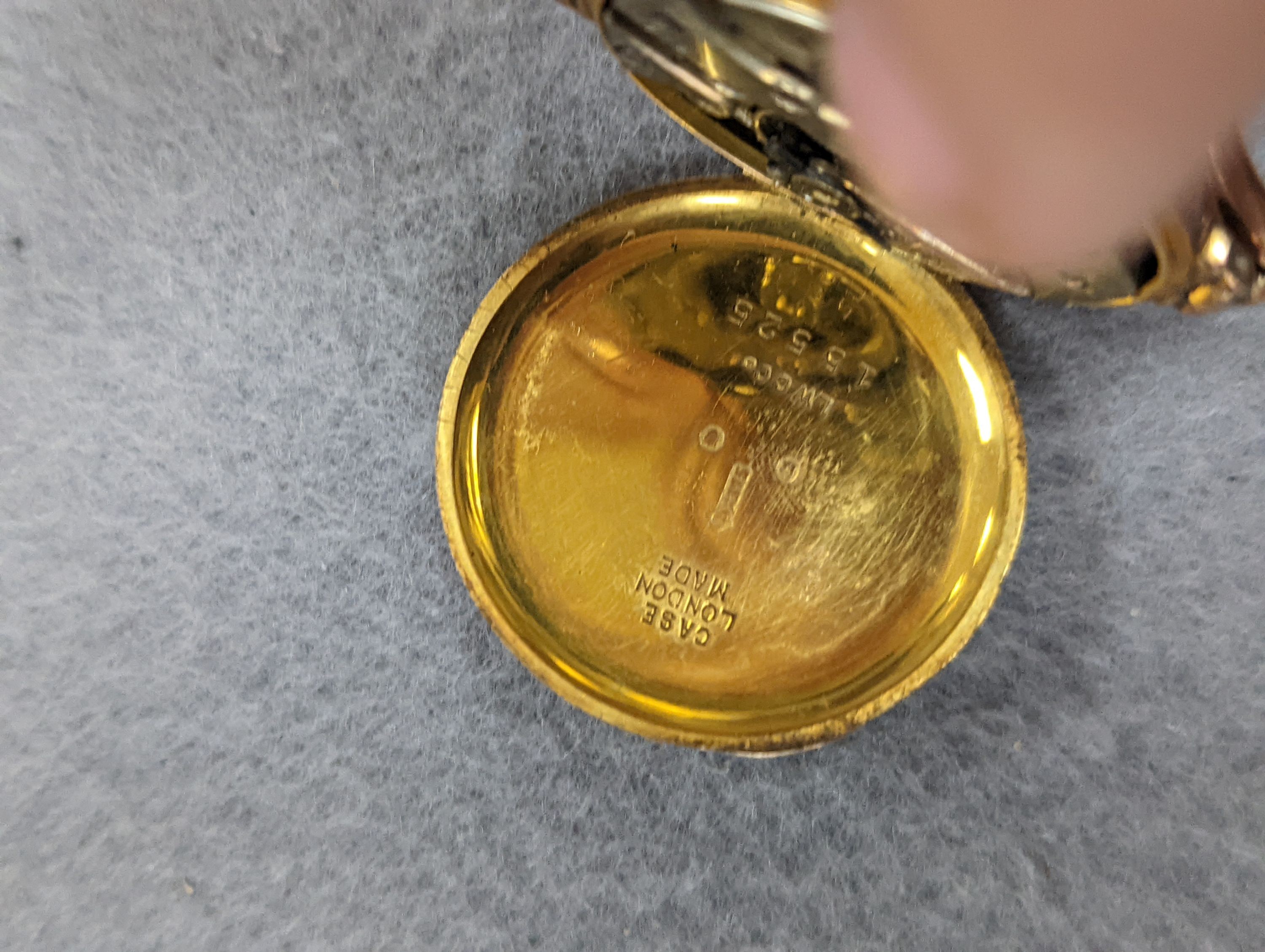 An 18k fob watch(a.f.) gross 20.4 grams, a 9ct wrist watch on a 9ct expanding bracelet, gross 20.7 grams, a gold plated pocket watch, an 800 fob watch and a 19th century silver pair cased verge keywind pocket watch, by J